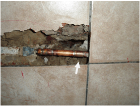 leak behind bathroom wall repaired with minimal damage